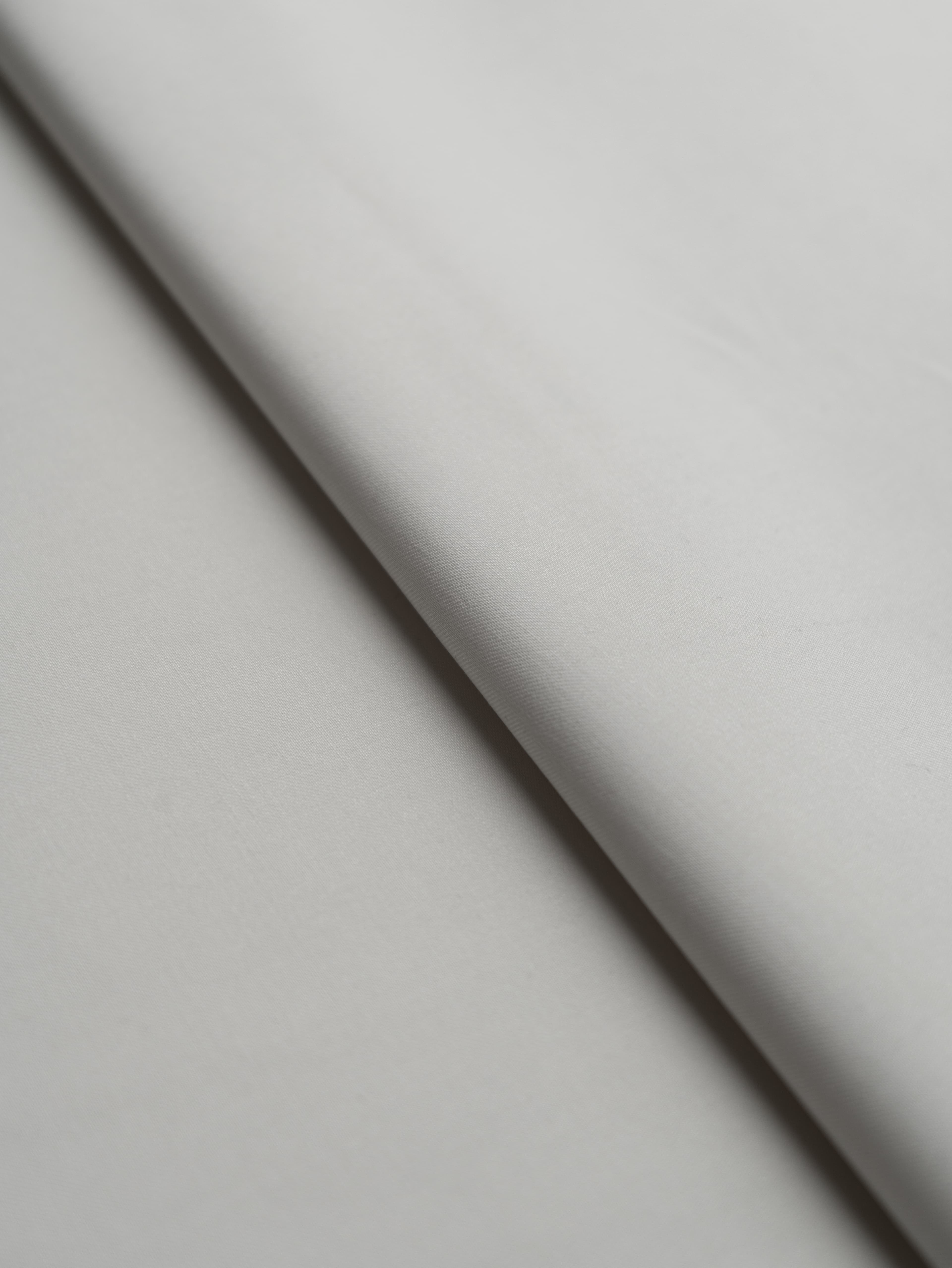 Close-up of Egyptian cotton fabric weave, breathable crisp finish