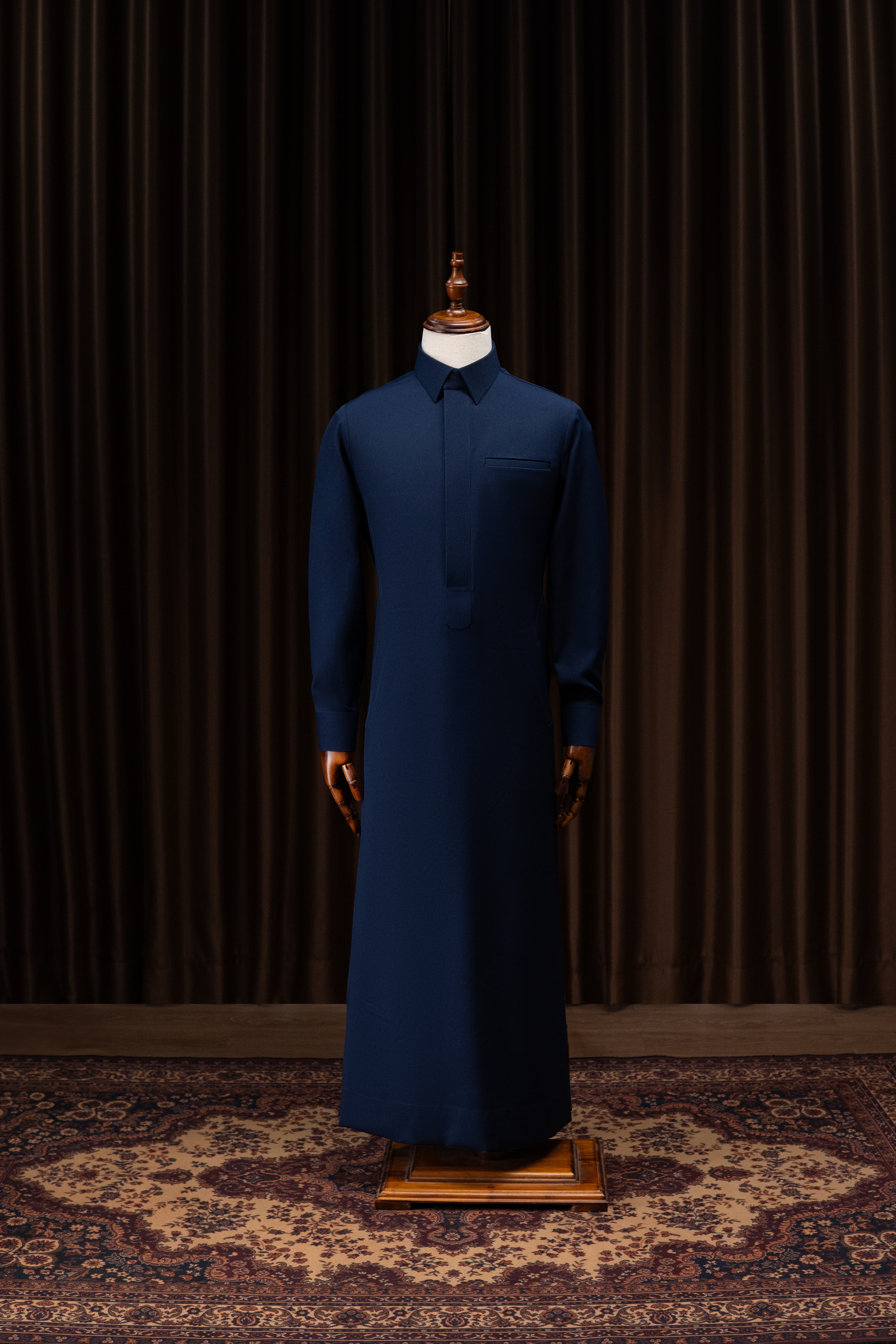 Bespoke thobe presented on a mannequin inside the Tarda workshop, editorial studio photography